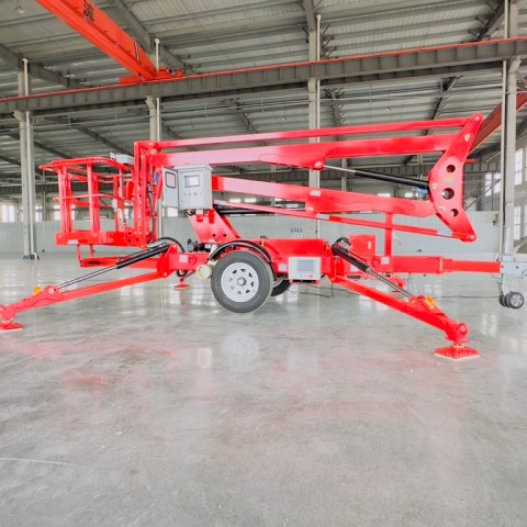 towable boom lift with articulated boom raised