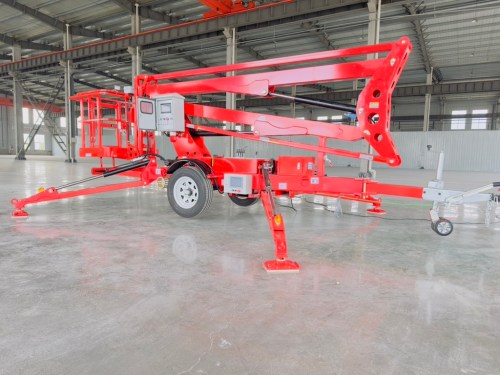 towable boom lift with articulated boom raised